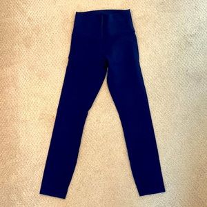 Lululemon mid-rise midi length legging in navy blue. Size 4.